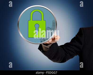 Hand pushing virtual security button Stock Photo