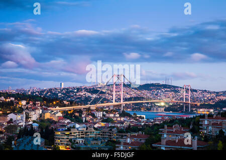 Twilight view of Bosphorus Bridge which is one of two suspension bridges spanning the Bosphorus strait in Istanbul Turkey Stock Photo
