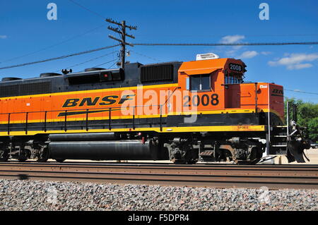 A single Burlington Northern Santa Fe locomotive unit sits on the main line in Rochelle, Illinois, USA. Stock Photo