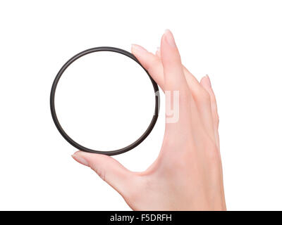Beautiful female hand holding camera filter isolated on white with clipping path. First person view Stock Photo