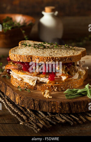 Homemade Leftover Thanksgiving Sandwich with Turkey Cranberries and Stuffing Stock Photo