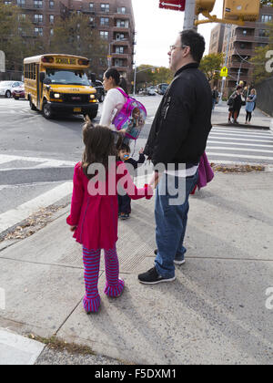 Children going home with parents after school in Kensington, Brooklyn, NY, 2015. Stock Photo