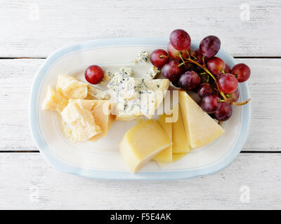 mix cheeses with grapes on plate Stock Photo