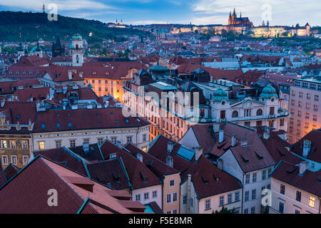 View over the Old Town rooftops towards St. Vitus's Cathedral at dusk, UNESCO World Heritage Site, Prague, Czech Republic Stock Photo