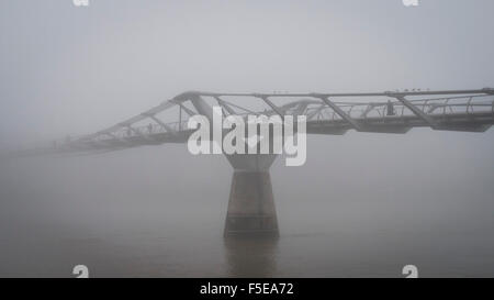 Thick Fog over The Millennium Bridge and River Thames this morning. Stock Photo