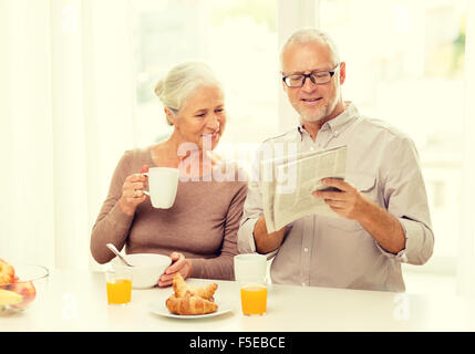 happy senior couple having breakfast at home Stock Photo