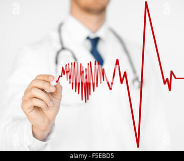 doctor drawing electrocardiogram on virtual screen Stock Photo