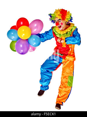 Happy birthday clown holding bunch of balloons.  Isolated. Stock Photo