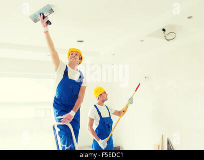 group of builders with tools indoors Stock Photo