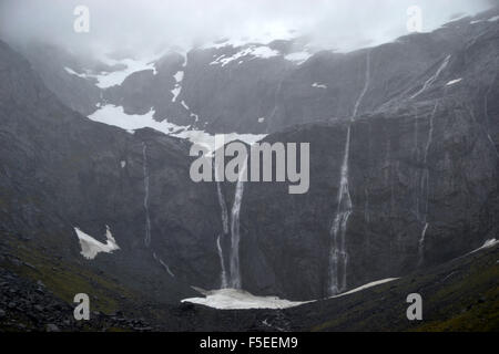Glacier waterfalls on the road to Milford Sound, Fiordland National Park, South Island, New Zealand Stock Photo