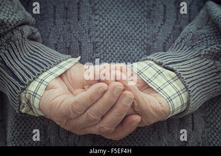 Rear view of a man holding hands behind his back Stock Photo