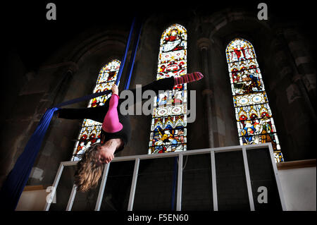 Hazel Maddocks has gone back to work as a trapeze and silk acrobat after giving birth to her baby Mea and she holds classes at the All Saints Centre in Lewes Stock Photo