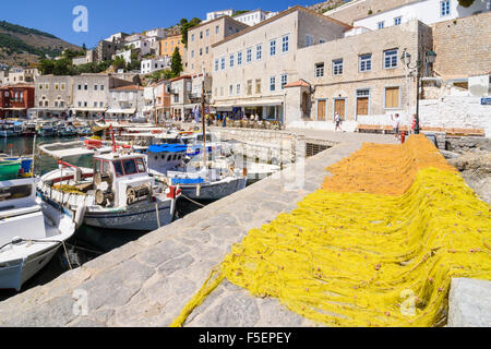 Fishing nets drying in the sun along Hydra Town waterfront, Hydra Island, Greece Stock Photo