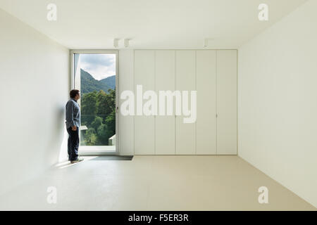 Architecture, new house interior,  room with a man inside Stock Photo