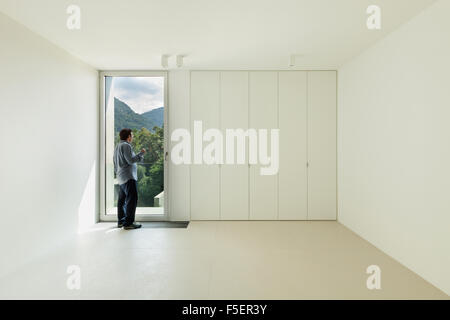 Architecture, new house interior,  room with a man inside Stock Photo