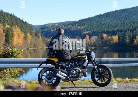 Motorcycle driver in autum, Germany, near city of Riefensbeek 2. November 2015. Photo: Frank May Stock Photo