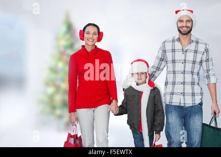 Composite image of happy family looking at camera Stock Photo