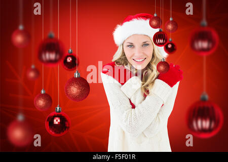 Composite image of happy festive blonde Stock Photo