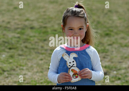 Child, little girl with baked Easter bunny, Easter, Upper Bavaria, Bavaria, Germany Stock Photo