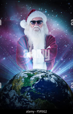 Composite image of santa claus wears black sunglasses Stock Photo