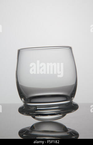 Empty glass of whisky on white background Stock Photo