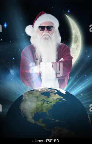 Composite image of santa claus wears black sunglasses Stock Photo