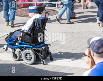 Senior man in wheelchair wearing Toronto Blue Jays Hat and jersey in Toronto, Ontario, Canada Stock Photo