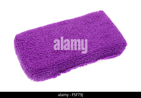 A new purple microfiber kitchen sponge isolated on a white background. Stock Photo