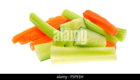 A serving of snack vegetables with cucumbers celery and carrots isolated on a white background. Stock Photo