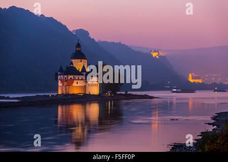 Burg Pfalzgrafenstein castle, Upper middle Rhine valley, Germany, near Kaub, at dusk, in the back city of Oberwesel Stock Photo