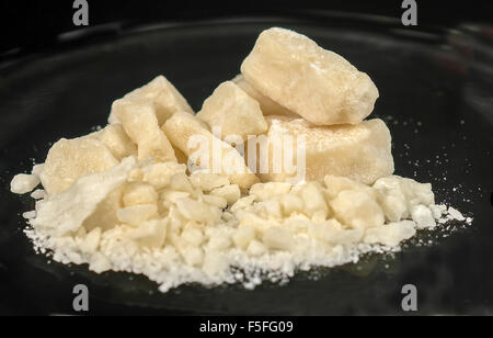 Crack cocaine is a form of cocaine that can be smoked. Also called rock, work, hard, iron, cavvy, base. Mostly known as crack. Stock Photo