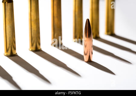 Macro shot of bullet casings on a white studio background Stock Photo