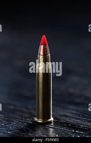 Small-caliber tracer cartridges on a dark background Stock Photo