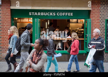 London, UK, UK. 12th Sep, 2011. People walk past an open front and very small Starbucks Coffee shop at night in the Soho district of London. © Ruaridh Stewart/ZUMAPRESS.com/Alamy Live News Stock Photo