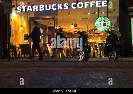 London, UK, UK. 12th Sep, 2011. Scooters parked outside a Starbucks Coffee shop at night in the Soho district of London. © Ruaridh Stewart/ZUMAPRESS.com/Alamy Live News Stock Photo