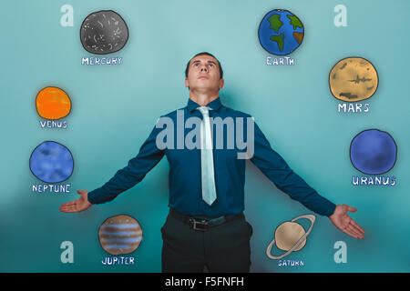 businessman man looks up and stretched out his hands to the side Stock Photo