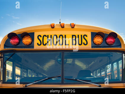 Front closeup view of a yellow school bus Stock Photo