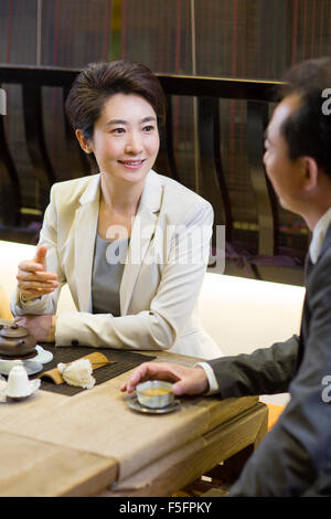 Business person drinking tea in tea room Stock Photo