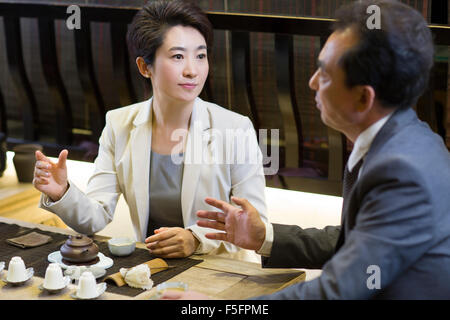 Business person drinking tea in tea room Stock Photo