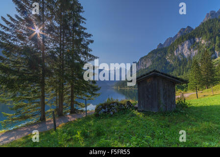 Fantastic morning on mountain lake Gosausee, located in the Austia. Dramatic unusual scene. Alps, Europe. Stock Photo