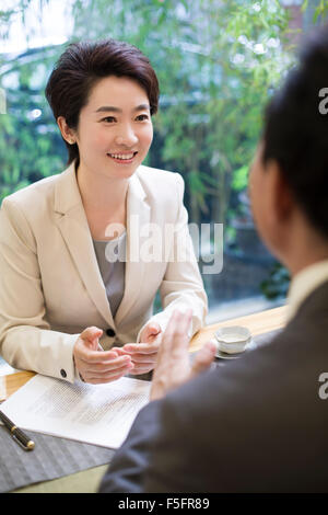 Business person discussing in tea room Stock Photo