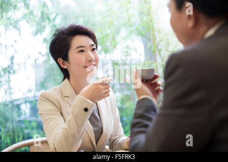 Business person discussing in tea room Stock Photo