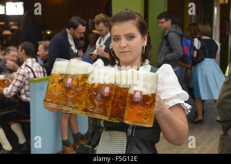 Waitress carrying masses of beer at Oktoberfest in Munich, Germany ...