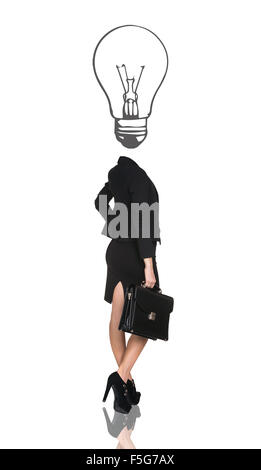 Business woman with big bulb instead head Stock Photo