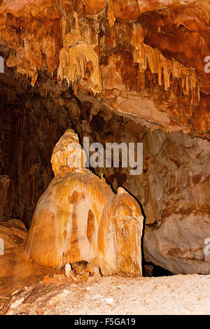 Inside view of an underground cavern or cave with stalagmites and stalactites. Limestone formations on the wall of an undergroun Stock Photo