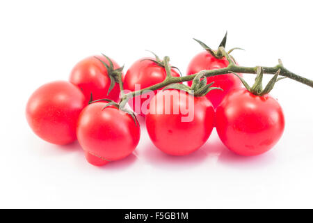 Cherry tomatoes isolated on white. Stock Photo