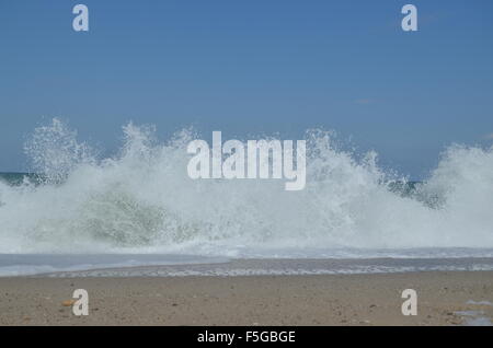 Waves breaking sharply  forming white spray at Black Sea Shore in Yalikoy, Catalca, Turkey. Stock Photo