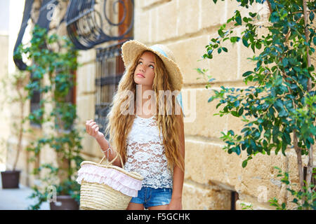 Blond tourist girl in mediterranean old town of Spain Stock Photo