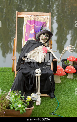 Kingston London,UK. 4th November 2015. A skeleton on a deck chair. The deck of a barge moored on River Thames in Kingston with Halloween decorations Credit:  amer ghazzal/Alamy Live News Stock Photo