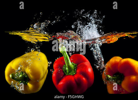 Studio work with water and peppers. Stock Photo